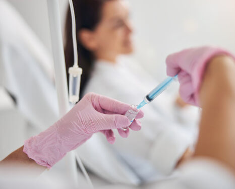 doctor holding an injection
