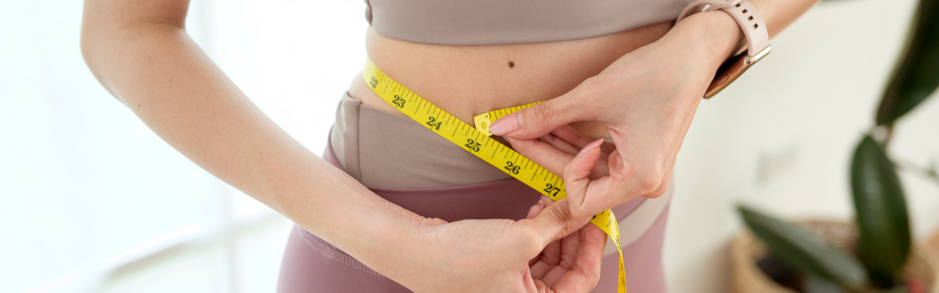 Woman Measuring Waistline