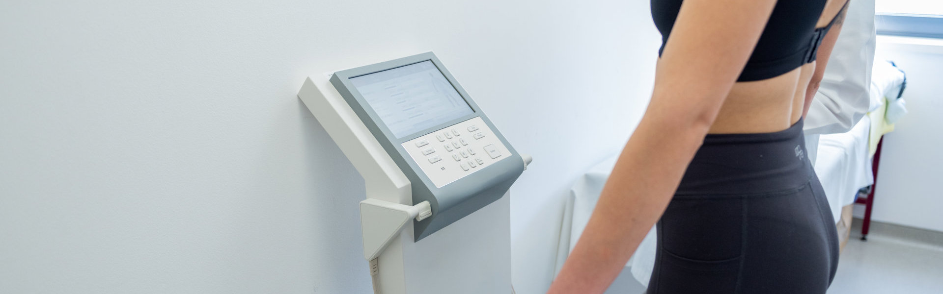 a woman undergoes a body composition